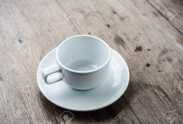 empty cup of coffee on wood background