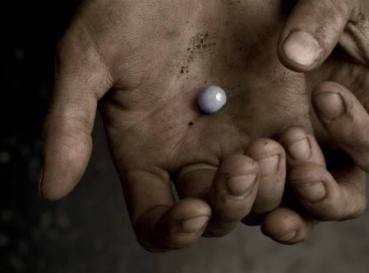 pearl in dirty hands